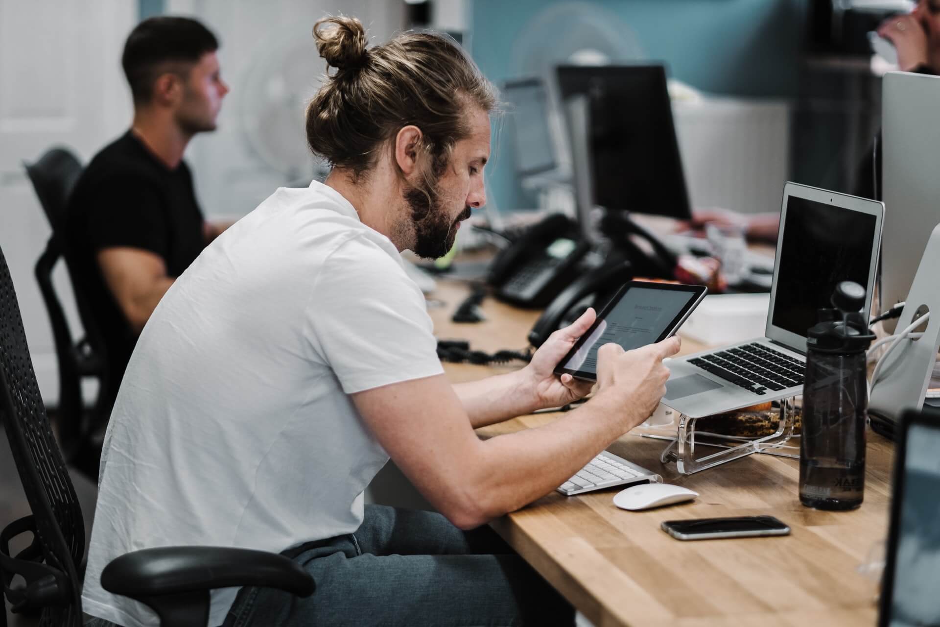 Image of a man sitting at desk